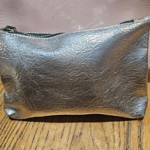 Various makeup in ipsy bag with a silver makeup bag NWOT